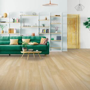 Green sofa on Laminate floor | Shans Carpets And Fine Flooring Inc