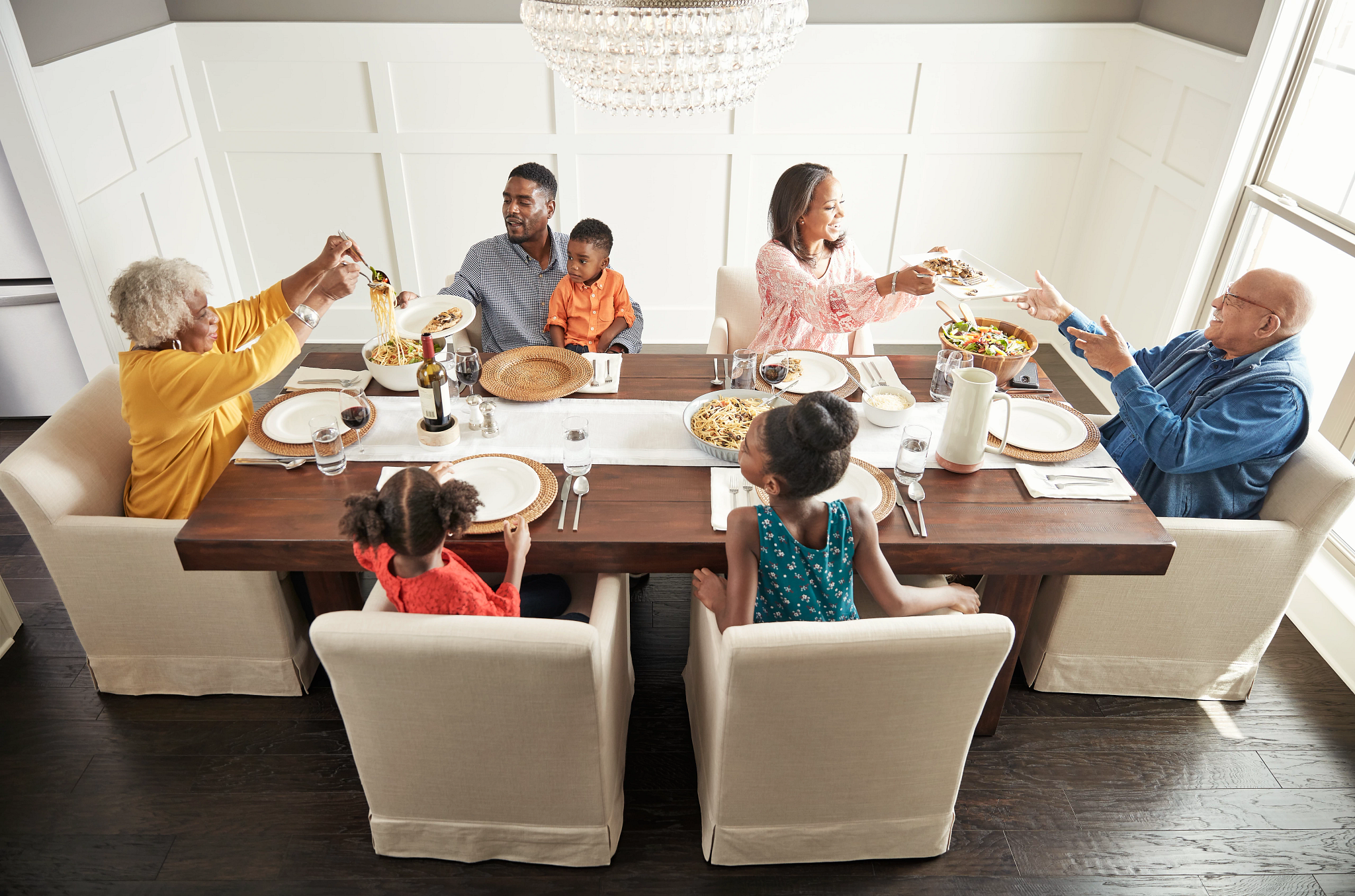 Family having breakfast at the dining table | Shans Carpets And Fine Flooring Inc