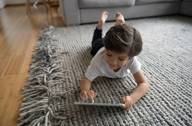 Girl lying on rug | Shans Carpets And Fine Flooring Inc